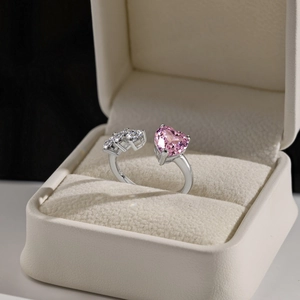 Detail of a pink heart-shaped stone ring in a premium jewelry box gift set