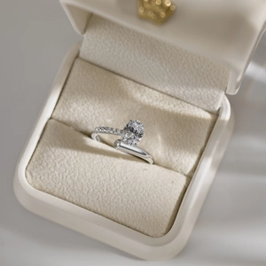 Elegant S925 sterling silver ring with oval gemstone and pavé band in luxury box