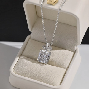 Detailed close-up of S925 silver necklace with rectangular cut zircon in a jewelry box