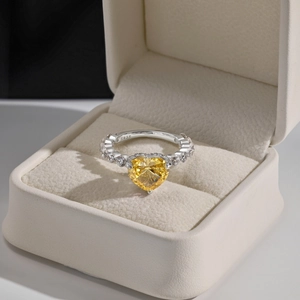 Detail of S925 sterling silver ring featuring a large heart-shaped yellow gemstone