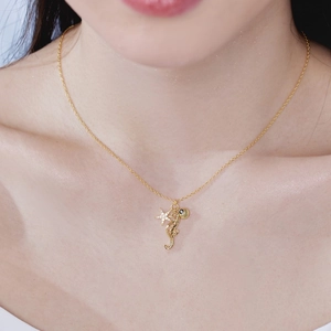 S925 sterling silver ocean necklace with seahorse, starfish and shell pendants on woman