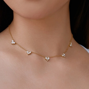 Elegant gold heart necklace for women featuring five sparkling zircon heart pendants