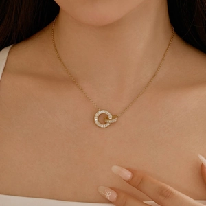 Close-up of elegant S925 silver double interlaced rings necklace with baguette zircons