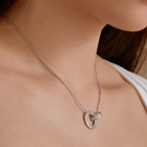 Detail of S925 sterling silver double-loop necklace with baguette-cut zircon pavé setting