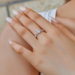 Elegant S925 silver Claddagh ring featuring a heart-shaped zircon and crown on a female finger