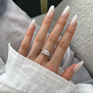Detailed view of S925 silver ring with a pear-shaped ice flower cut zircon on finger