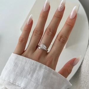 S925 sterling silver pear cut zircon ring with elegant twisted band design on hand