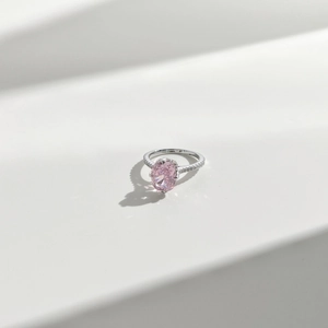 Close-up of S925 silver ring featuring an oval pink ice cut zircon and pave diamonds