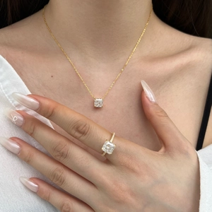 Close-up of S925 silver square zircon necklace and ring set on model skin