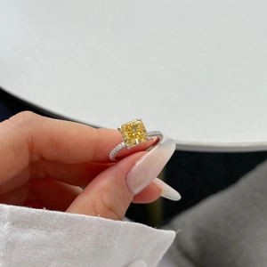Macro shot of S925 sterling silver ring featuring square yellow ice-cut cubic zirconia