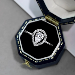 Elegant S925 sterling silver pear cut zircon halo ring in a navy blue jewelry box
