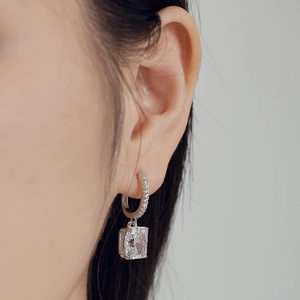 S925 sterling silver hoop earrings with 8x10mm emerald cut ice flower zircon on model