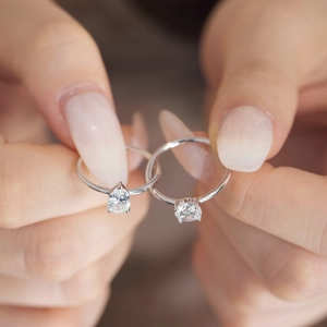 Detail of S925 sterling silver rings with pear and round cut cubic zirconia stones