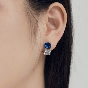 S925 sterling silver studs with square cut blue and white zircon stones on a model
