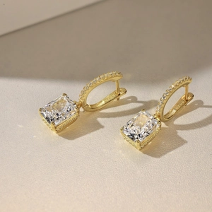 Close-up of S925 hallmark on gold plated silver earrings with large radiant cut zircon