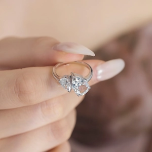 Elegant S925 sterling silver ring featuring double pear-shaped ice-cut zircon stones