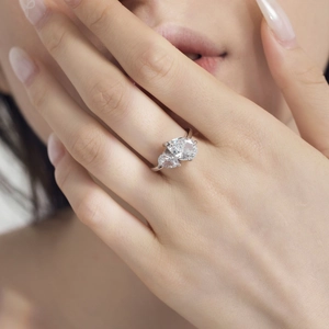 Elegant S925 sterling silver ring with twin pear-cut zircons in a crossover claw setting