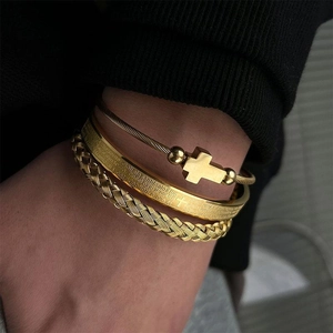 Three-piece gold stainless steel bracelet set with cross and Roman numeral details