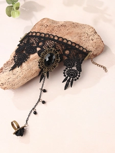 Gothic black lace slave bracelet with vintage gemstone and floral ring detail