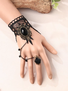 Gothic black lace slave bracelet featuring an oval gemstone and 3D rose ring detail