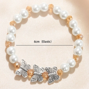 Elegant beaded pearl bracelet with silver butterflies and amber crystals, 6cm elastic fit