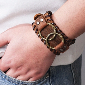Vintage Nordic leather cuff bracelet with bronze serpent rings and woven details for men