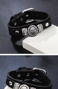 Detail of adjustable leather skull bracelet with metallic wrench design and buckle strap