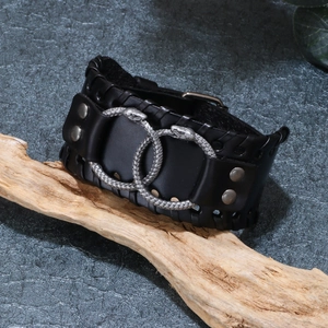 Vintage black leather wide cuff bracelet with silver Viking serpent rings and metal studs