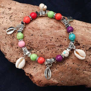 Bohemian multicolored beaded bracelet with turquoise, natural shells and heart pendants