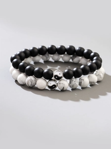 Détails des bracelets en perles Yin Yang avec pierres noires mates et blanches marbrées