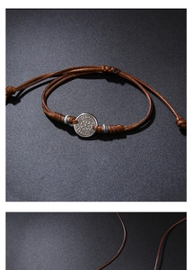 Detail of adjustable braided cord bracelet with Nordic Vegvisir compass charm