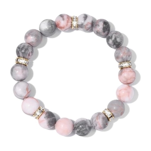 Pink marble stone beaded bracelet with golden rhinestone spacers on white backdrop