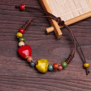 Handmade ceramic heart pendant bracelet with multi-color beads on brown braided cord