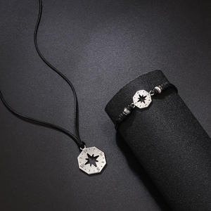 Compass star stainless steel pendant with black woven rope bracelet and necklace set
