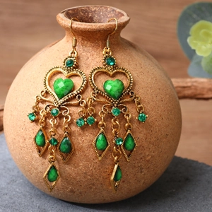 Ethnic style long tassel earrings with green rhinestones and antique gold finish