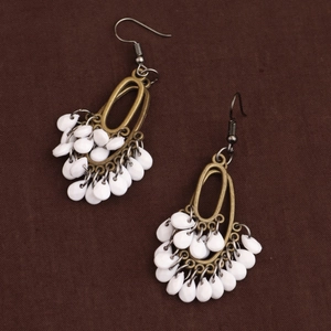 Bohemian drop earrings with white teardrop beads and vintage bronze metal frames