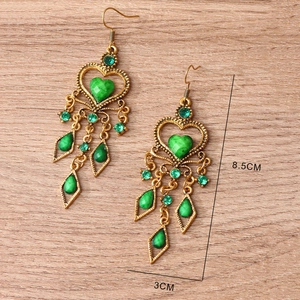 Ethnic bohemian drop earrings with green rhinestones and vintage gold tassels