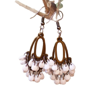 Bohemian vintage bronze earrings featuring elegant white teardrop bead tassels