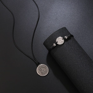 Adjustable black woven rope necklace and bracelet set with silver Norse compass pendant