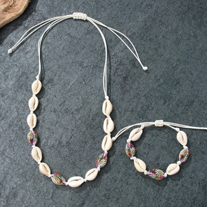 Handmade shell necklace and bracelet set with daisy prints for beach vacation
