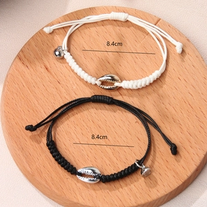 Adjustable woven shell magnet couple bracelets set in black and white minimalist style