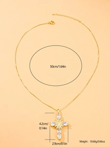 Detail view of gold cross pendant with cubic zirconia, size 4.2x2.9cm on 50cm chain