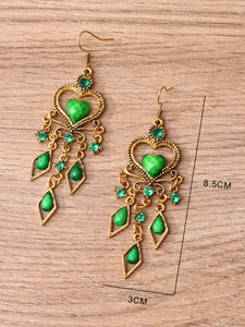 Ethnic style bohemian gold earrings with green rhinestones measuring 8.5cm by 3cm
