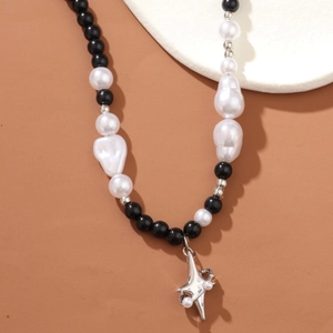 Modern mixed black beads and white baroque pearl necklace with silver star pendant charms