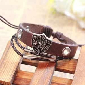 Vintage dark brown leather multi-layer cross shield bracelet with adjustable woven cords