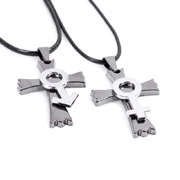 Detail of cross pendants with gender symbols and black cords for couples