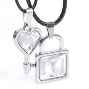 Detail of couple necklace set with heart key and square lock pendants dated 2013