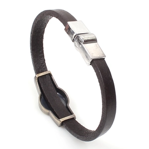 Close-up of dual-layer dark brown leather bracelet with silver magnetic metal clasp