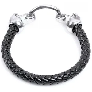 Detail of black braided leather bracelet with embossed silver metal buckle clasp