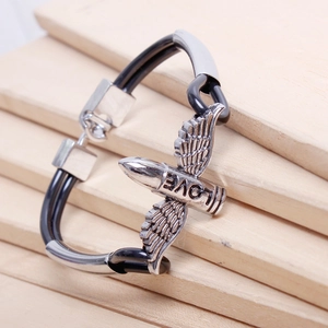 Detail of punk style PU leather cord bracelet with silver LOVE wing bullet charm